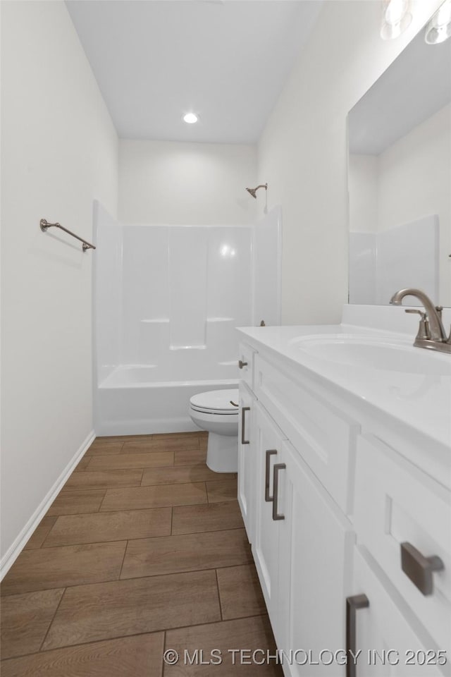 full bathroom featuring vanity, shower / bathing tub combination, and toilet