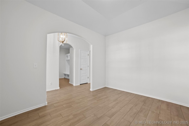 empty room with light hardwood / wood-style flooring