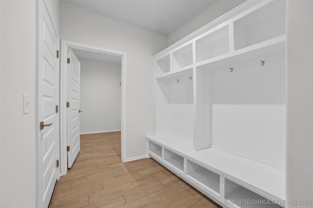 mudroom with light hardwood / wood-style flooring