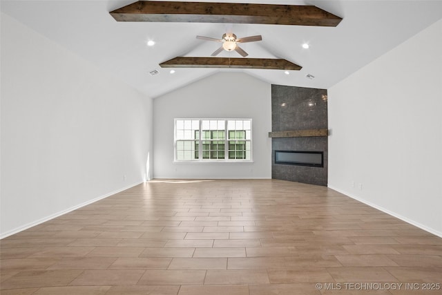 unfurnished living room with light hardwood / wood-style flooring, a tile fireplace, ceiling fan, beam ceiling, and high vaulted ceiling