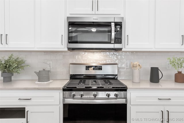 1941 W Huntsville Pl, Broken Arrow, OK 74011 - kitchen featuring stainless steel appliances, white cabinetry, and backsplash