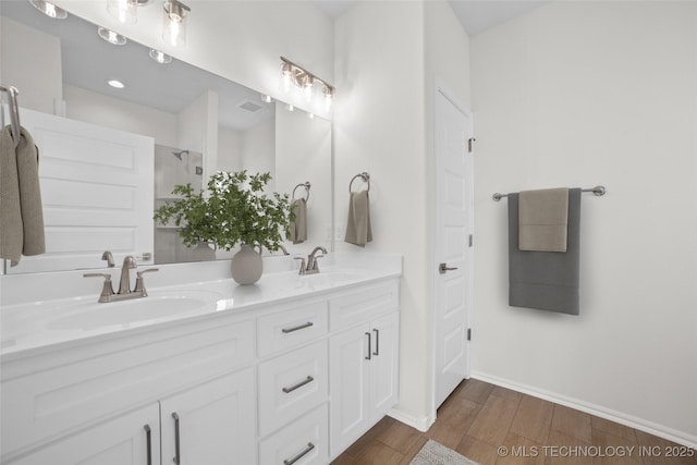 1941 W Huntsville Pl, Broken Arrow, OK 74011 - bathroom with double vanity, wood finished floors, and a shower