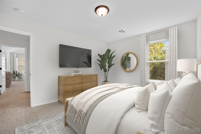 bedroom featuring light colored carpet