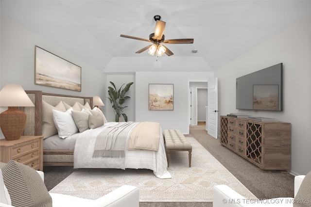 bedroom with vaulted ceiling, ceiling fan, and carpet