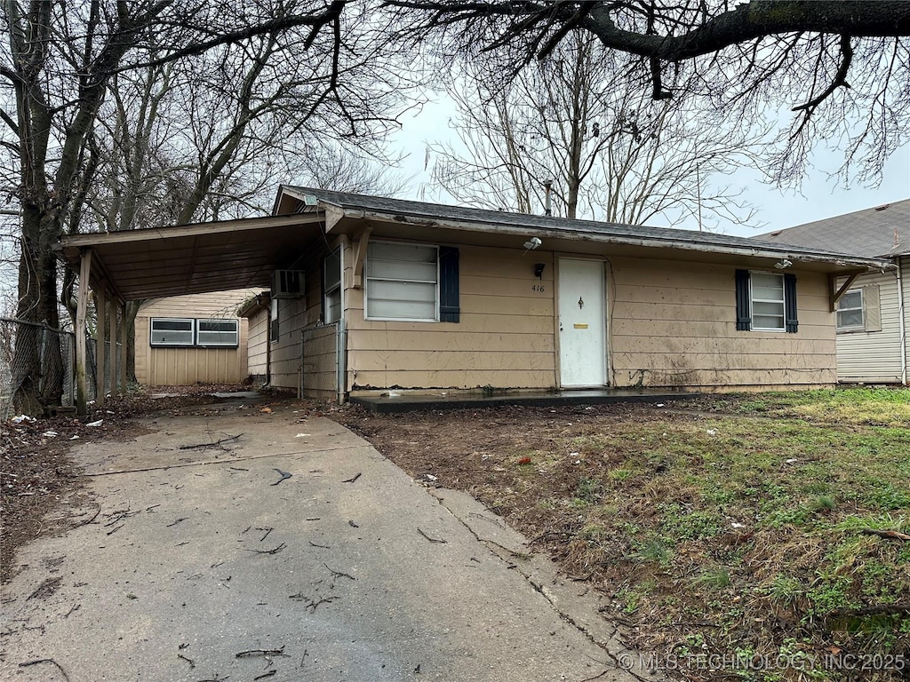 ranch-style house with a carport