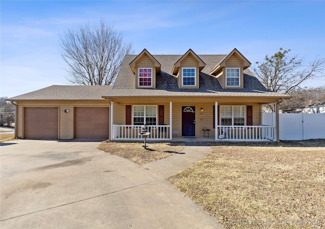 view of front facade featuring a garage and covered porch