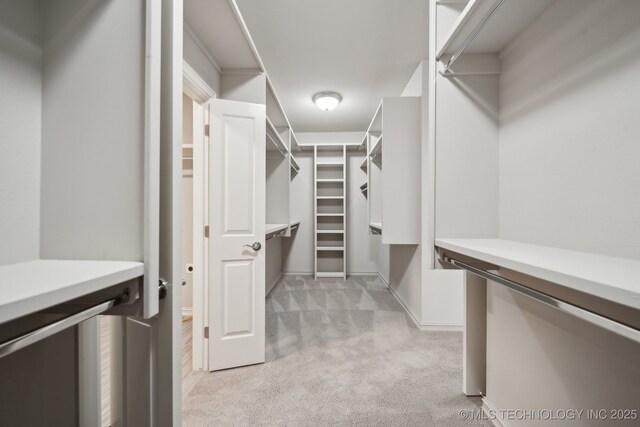 washroom with sink, electric dryer hookup, hookup for a washing machine, cabinets, and light wood-type flooring