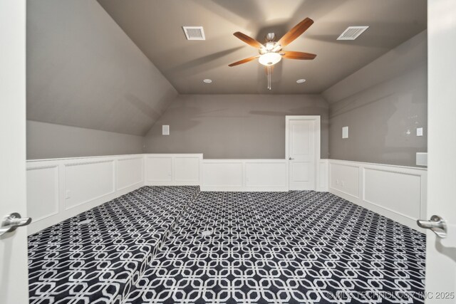 bonus room featuring lofted ceiling and ceiling fan