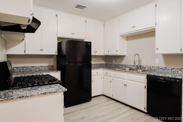 kitchen with white cabinetry, sink, light hardwood / wood-style flooring, and black appliances