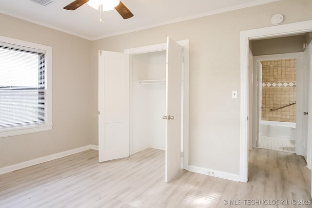 unfurnished bedroom featuring light hardwood / wood-style flooring, ornamental molding, a closet, and ceiling fan