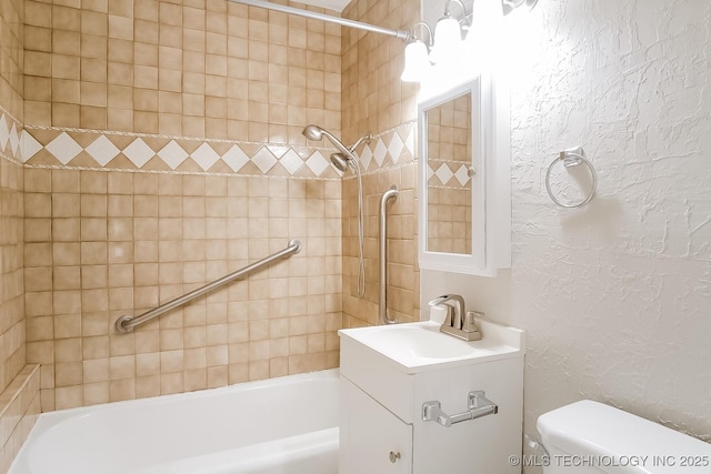 full bathroom with vanity, toilet, and tiled shower / bath combo