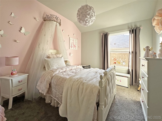 bedroom with carpet floors and vaulted ceiling