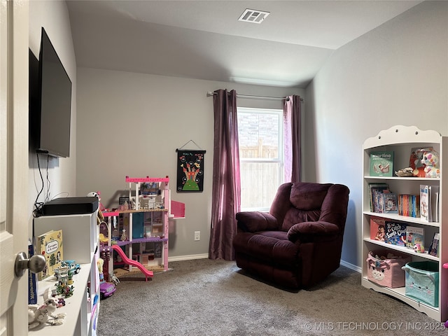 playroom featuring lofted ceiling and carpet flooring