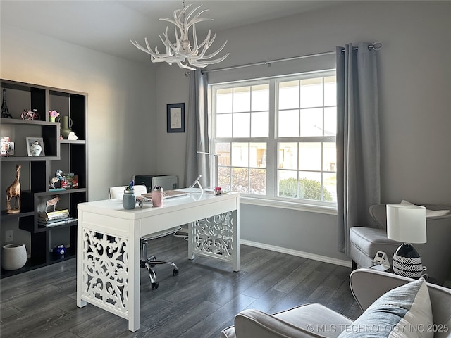 office area with dark hardwood / wood-style flooring and an inviting chandelier