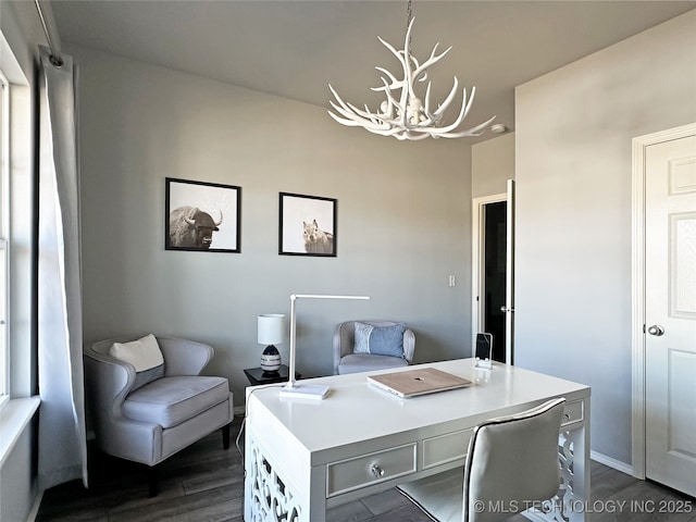 office area featuring dark hardwood / wood-style floors and a chandelier