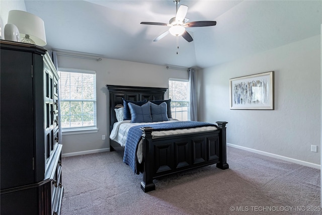 carpeted bedroom featuring vaulted ceiling and ceiling fan