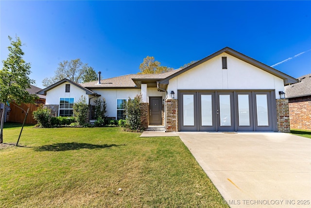 view of front of home featuring a garage and a front lawn