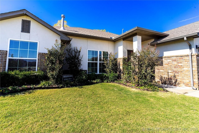 exterior space featuring a front lawn