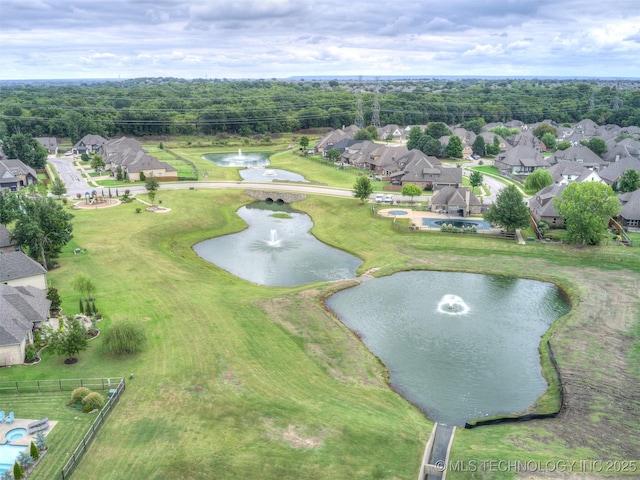 drone / aerial view with a water view