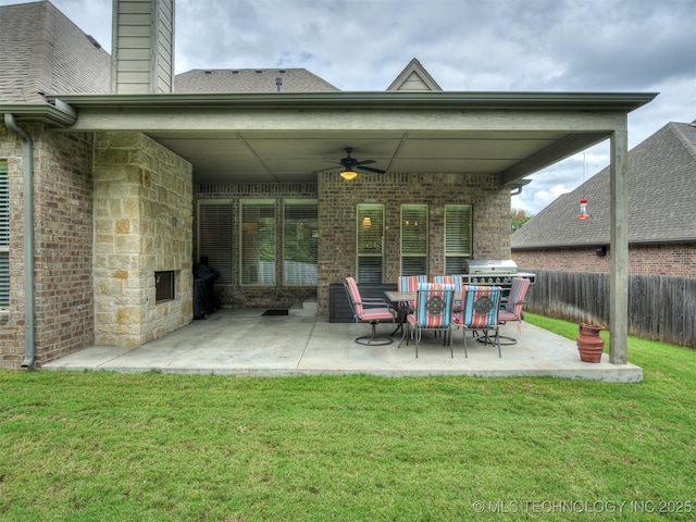 view of patio / terrace with area for grilling and ceiling fan