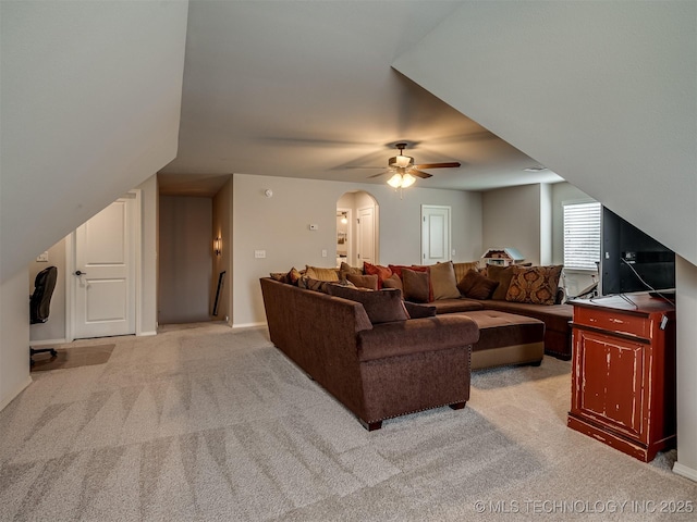 carpeted living room featuring ceiling fan