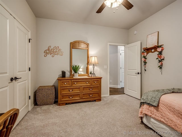 carpeted bedroom with ceiling fan