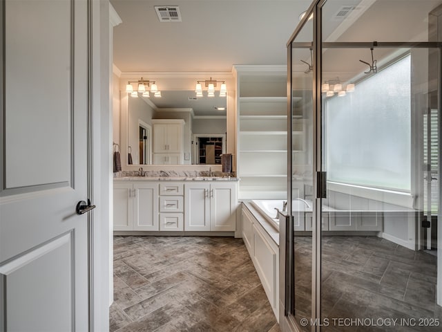 bathroom featuring ornamental molding, vanity, and shower with separate bathtub