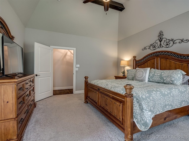 bedroom featuring ceiling fan, high vaulted ceiling, and light carpet