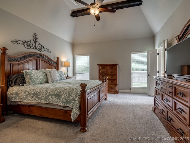 carpeted bedroom featuring ceiling fan and high vaulted ceiling