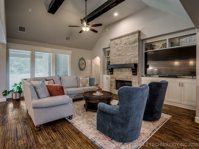 living room with ceiling fan, high vaulted ceiling, a fireplace, dark hardwood / wood-style flooring, and beamed ceiling