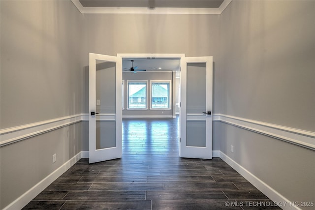 interior space featuring ornamental molding and dark hardwood / wood-style flooring