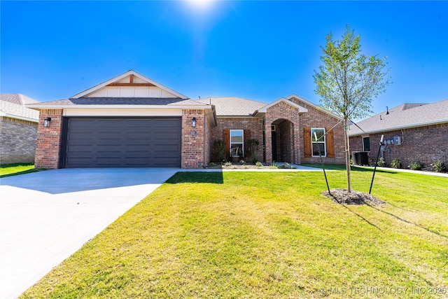 ranch-style home with cooling unit, a garage, and a front yard