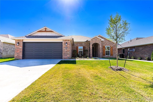 ranch-style house featuring central AC unit, a garage, and a front yard