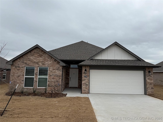 ranch-style home featuring driveway, brick siding, roof with shingles, and an attached garage