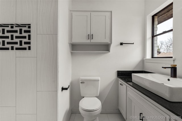 bathroom with vanity, tile patterned floors, and toilet