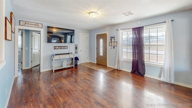 entryway with dark hardwood / wood-style floors