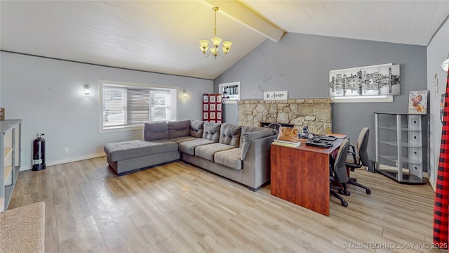 office area featuring a chandelier, a stone fireplace, light hardwood / wood-style floors, and lofted ceiling with beams