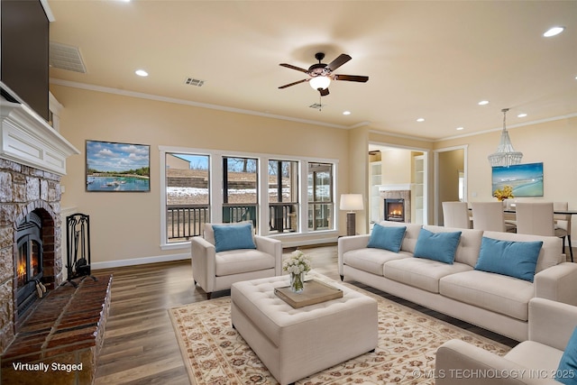 living room featuring crown molding, ceiling fan, and hardwood / wood-style floors