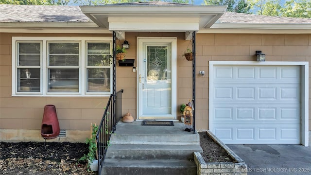 doorway to property featuring a garage