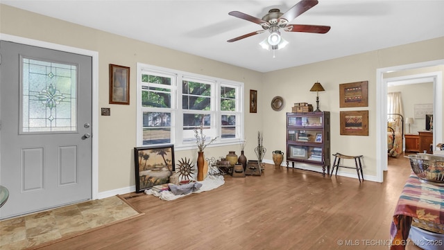 interior space featuring hardwood / wood-style floors and ceiling fan