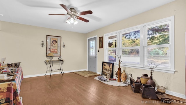 miscellaneous room featuring ceiling fan and dark hardwood / wood-style floors