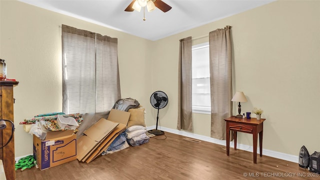 miscellaneous room with hardwood / wood-style floors and ceiling fan