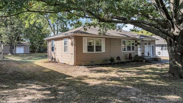 view of front of house featuring a shed