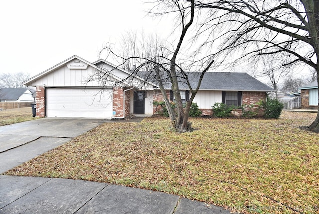 single story home featuring a garage and a front yard