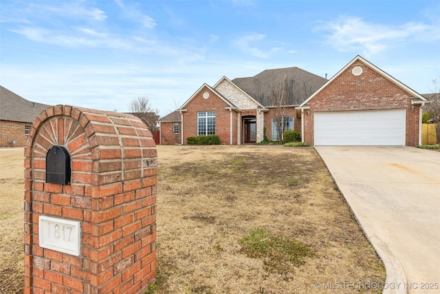 view of front of property featuring a garage and a front yard