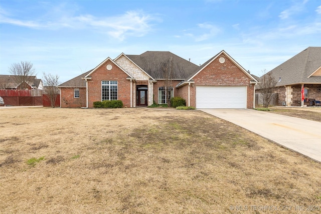 view of front of house with a garage and a front yard