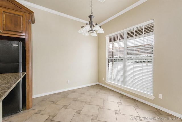 unfurnished dining area with crown molding and an inviting chandelier