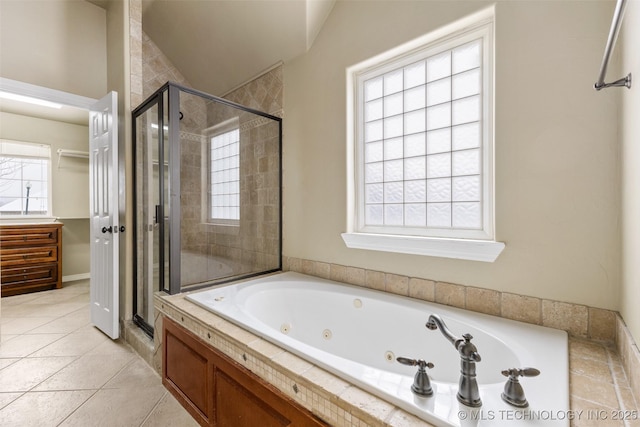 bathroom with vaulted ceiling, tile patterned floors, and separate shower and tub