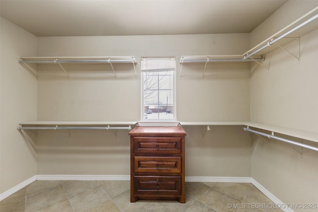 walk in closet featuring light tile patterned floors