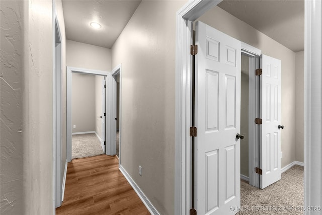 corridor featuring hardwood / wood-style flooring